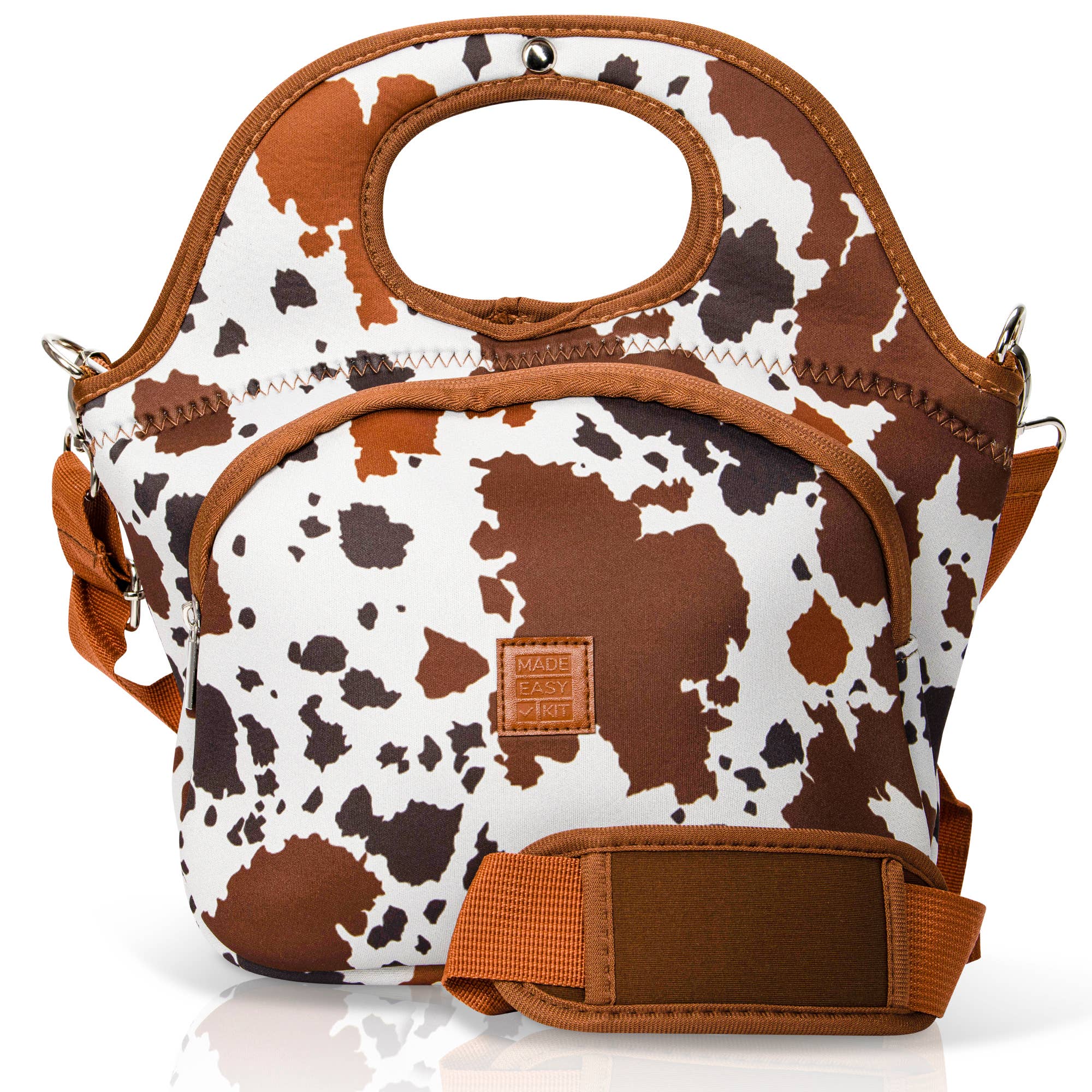Cow print bag with brown accents on a white background